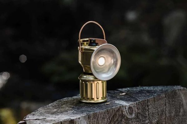 Miners Lantern Side Angle On Timber Log