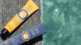 SunButter SPF50 Sunscreen 120g Tube next to packet